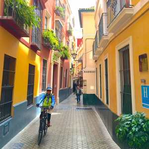 cyclist in narrow street andalucia